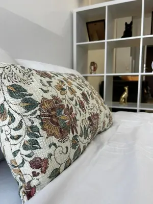 a pillow sitting on top of a bed at Rea Silena - Modern and Stylish Studio in Sofia