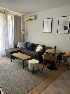 a living room with a couch and a table at Guest House Amaya by novotela in Plovdiv