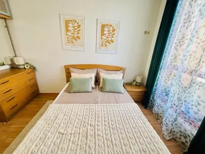 a bedroom with a bed with two pillows at Guest House Amaya by novotela in Plovdiv