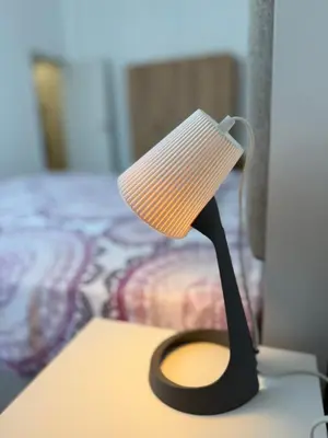 a black and white lamp sitting on a table at Stylish 2-Bedroom Apartment in Top Center - 5m walk to Metro station Serdika, Sofia statue -- 1 FullBath & 1Washroom in Sofia