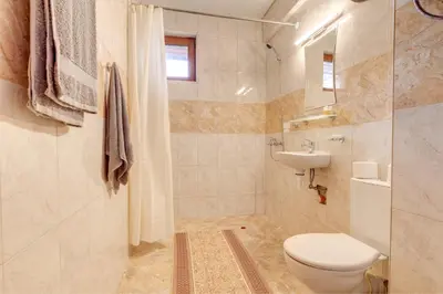 a bathroom with a toilet and a sink at Villa Cometa Pamporovo - 1BD Near Slope #7 by Flat Manаger in Pamporovo