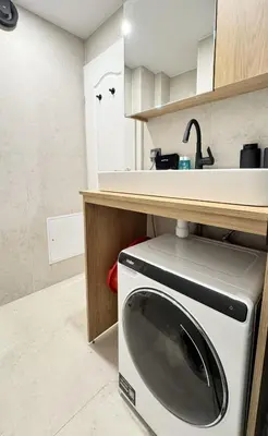 a kitchen with a washing machine under a counter at Cosy & Modern 1BD Flat close to NDK by Flat Mаnager in Sofia