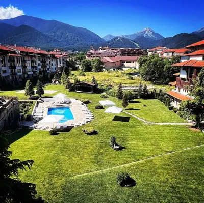 a large yard with a swimming pool and some buildings at Barosa Apartment Bansko Royal Towers in Bansko