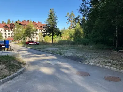 a road with a car parked on the side of it at Borovets Gardens apartment C-43 in Borovets