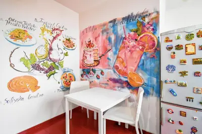 a dining room with a table and a refrigerator at Spacious 3BR in the Center - Kitchen Smart TV's in Sofia