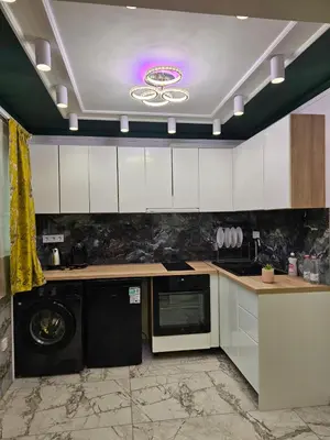 a kitchen with a washer and dryer in it at Luxury Continental two rooms in Sofia