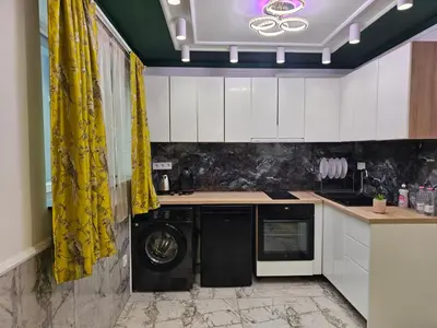 a kitchen with a washer and dryer in it at Luxury Continental two rooms in Sofia