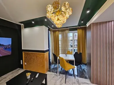 a conference room with a table and a projection screen at Luxury Continental two rooms in Sofia