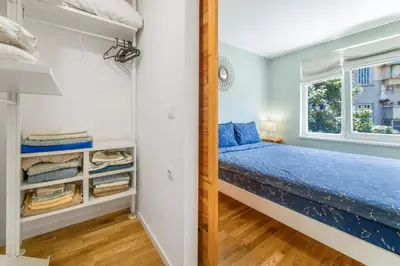 a bedroom with a bed and a window at Charming Downtown Apartment with Unique Terrace in Sofia