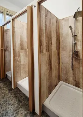 a bathroom with a shower and a bath tub at Key Hostel Vitosha in Sofia