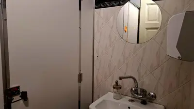 a bathroom with a sink and a mirror at Key Hostel Vitosha in Sofia