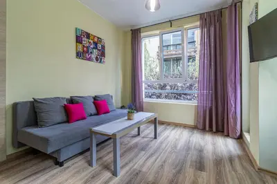 a living room with a couch and a table at My Space Deluxe One Bedroom Apartment in Sofia