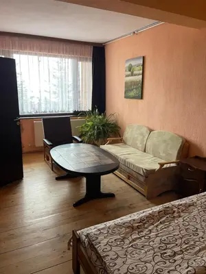 a living room with a couch and a table at Къща за гости Лясково in Lyaskovo