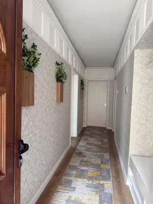 a hallway with potted plants on the wall at Нощувки 