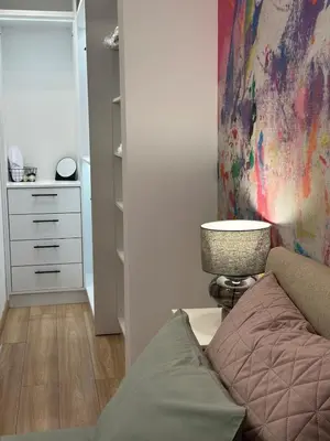 a living room with a couch and a dresser at K&D Alpine Getaway , Cozy Stay in Bansko
