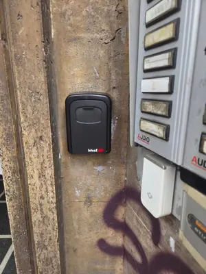 a black cell phone sitting on the ground next to a truck at Grand Luxury Condo by NDK and National Stadium with Free Security Parking in Sofia