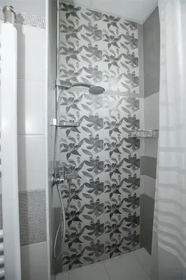 a shower with a bunch of shoes on the wall at В Сандански есента идва с топлина, слънце и златна светлина in Sandanski