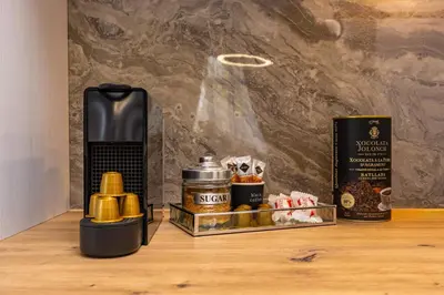 a shelf with a coffee maker and a box of spices at Central Apartments with Garden view by Flat Mаnager in Plovdiv