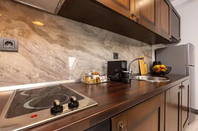 a kitchen with a sink and a counter top at Central Apartments with Garden view by Flat Mаnager in Plovdiv