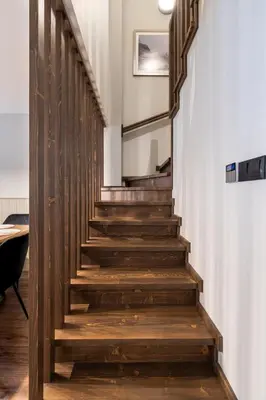 a staircase in a house with wooden steps at 3 Спални - Електрическо Подово Отопление - Бърз WiFi - Веранда - В Гората - Warm Forest Nest Pamporovo in Pamporovo