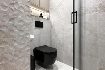 a bathroom with a black toilet in a room at Modern & Quiet 1BR Near Center by Flat Mаnager in Sofia
