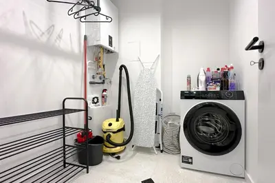 a white laundry room with a washing machine in it at Modern & Quiet 1BR Near Center by Flat Mаnager in Sofia