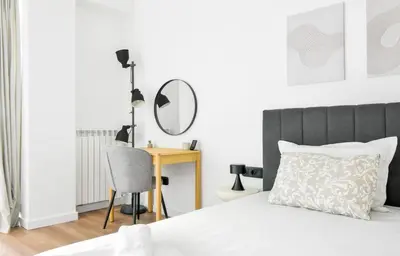 a bedroom with a bed with a mirror and a desk at Modern & Quiet 1BR Near Center by Flat Mаnager in Sofia