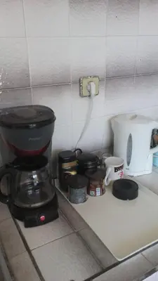 a coffee maker on a counter in a kitchen at Guest House Jani in Trigrad