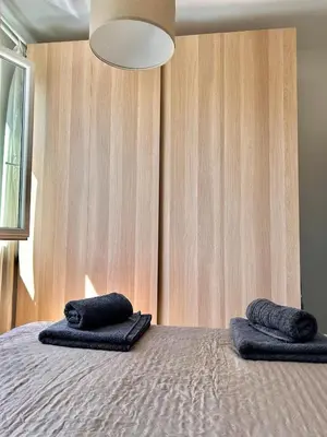 a bedroom with a bed with two pillows on it at Cozy&Quiet l 1BD l Free Parking in Sofia