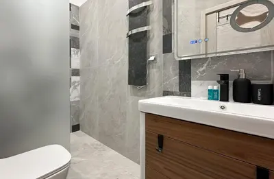 a bathroom with a sink and a toilet at Blue Breeze Apartment by Flat Mаnager in Sofia