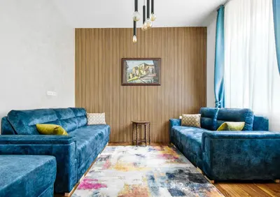 a living room with two blue couches at Blue Breeze Apartment by Flat Mаnager in Sofia