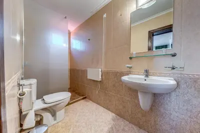 a bathroom with a toilet and a sink and a mirror at Тристаен апартамент 1А17 Гранд Манастира Пампорово in Pamporovo