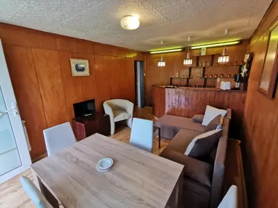 a dining room with a table and chairs at Villa Aqua in Pravets