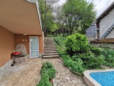 a house with a swimming pool next to a house at Villa Aqua in Pravets