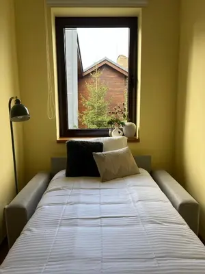 a large bed in a room with a window at Deno Studio in Borovets