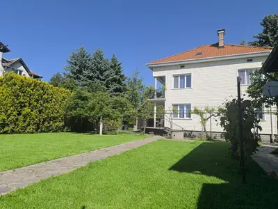 a house with a yard with green grass at City Garden - Amazing Garden for party and friends in Kostinbrod