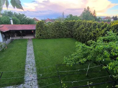 a backyard with a fence and a grass yard at City Garden - Amazing Garden for party and friends in Kostinbrod