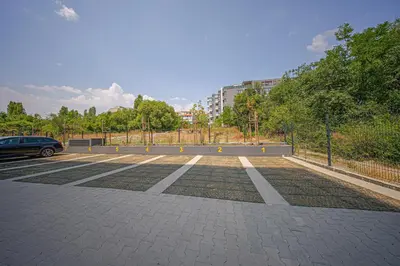 a parking lot with a car parked in it at NOAR - Free parking - Metro access in Sofia