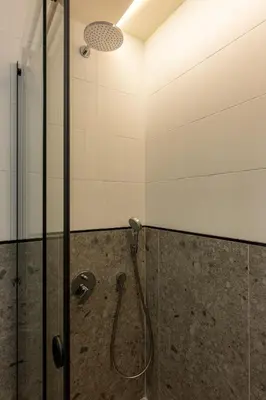 a shower in a bathroom with a glass door at Private Premium Apartment in Plovdiv in Plovdiv