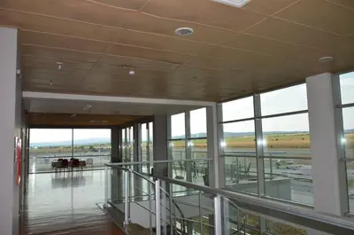 an empty building with a view of the airport at Хотел Летище Лесново in Ormanliya