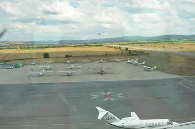 a group of planes parked on an airport runway at Хотел Летище Лесново in Ormanliya