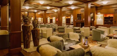 a waiting room with couches and chairs at Green Life Private Apartment D25 in Bansko