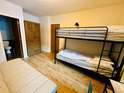 a room with two bunk beds and a couch at Grand Resort Pamporovo b19 in Pamporovo