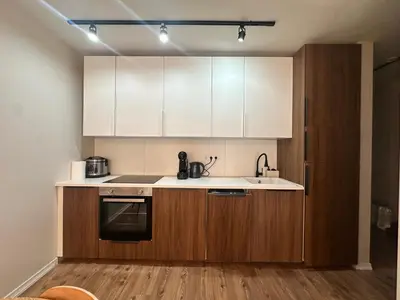 a kitchen with white cabinets and a sink at Grand Resort Pamporovo b19 in Pamporovo