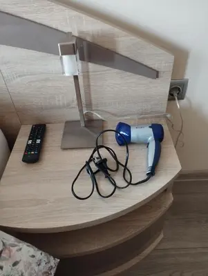 a desk with a lamp and a hair dryer on it at Nadi in Plovdiv