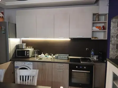 a small kitchen with a sink and a microwave at Zoraja in Sofia