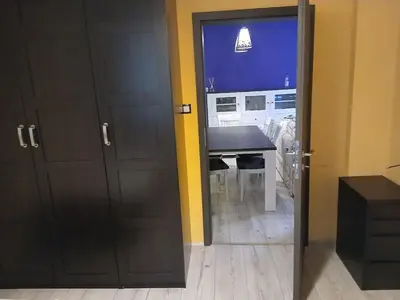 an open door to a room with a table and a desk at Zoraja in Sofia