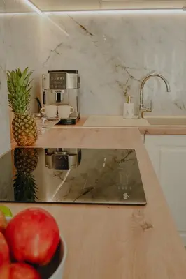 a kitchen with a counter top with a coffee maker and fruit at Elegant Escape-High Ceilings, Balcony & Piano by Flat Mаnager in Sofia