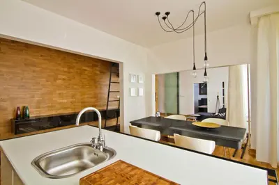 a kitchen with a sink and a dining room at Casa Desideria 2BAD 2BATH, PARKING , Vitosha Blvd in Sofia