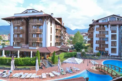 a hotel with a swimming pool and some buildings at Cozy Flat with Pool & Mountain Views, Near Gondola by Flat Mаnаger in Bansko